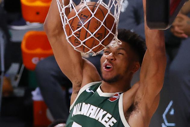 Milwaukee Bucks' Giannis Antetokounmpo (34) dunks against the Dallas Mavericks during overtime of an NBA basketball game Saturday, Aug. 8, 2020, in Lake Buena Vista, Fla. (Kevin C. Cox/Pool Photo via AP)