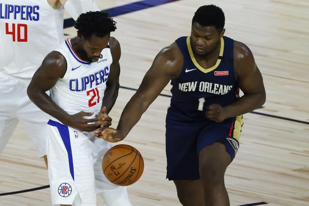 Los Angeles Clippers' Patrick Beverley, left, loses the ball as New Orleans Pelicans' Zion Williamson defends during the first half of an NBA basketball game Saturday, Aug. 1, 2020, in Lake Buena Vista, Fla. (Kevin C. Cox/Pool Photo via AP)