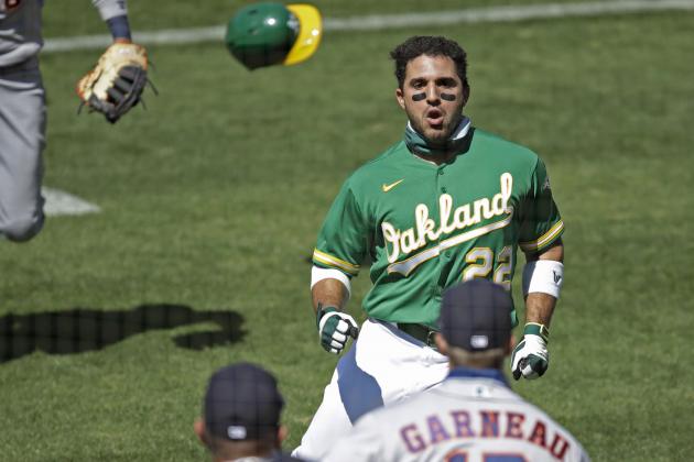Oakland Athletics' Ramon Laureano (22) charges the Houston Astros' dugout after being hit by a pitch thrown by Humberto Castellanos during the seventh inning of a baseball game Sunday, Aug. 9, 2020, in Oakland, Calif. (AP Photo/Ben Margot)