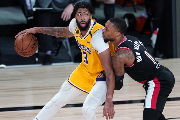 Los Angeles Lakers forward Anthony Davis (3) works the ball against Portland Trail Blazers guard Damian Lillard (0) during the second half of an NBA basketball game Tuesday, Aug. 18, 2020, in Lake Buena Vista, Fla. Portland won 100-93. (AP Photo/Ashley Landis, Pool)