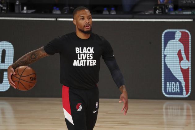 Portland Trail Blazers guard Damian Lillard (0) warms up before Game 2 of an NBA basketball first-round playoff series against the Los Angeles Lakers, Thursday, Aug. 20, 2020, in Lake Buena Vista, Fla. (Kim Klement/Pool Photo via AP)
