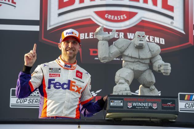 Denny Hamlin celebrates in Victory Lane after winning the NASCAR Cup Series auto race at Dover International Speedway, Saturday, Aug. 22, 2020, in Dover, Del. (AP Photo/Jason Minto)