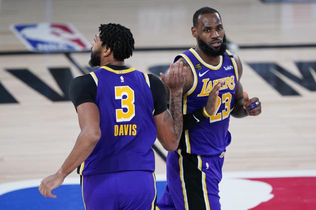 Los Angeles Lakers forward Anthony Davis (3) and forward LeBron James (23) celebrates a play during the second half of an NBA basketball first round playoff game against the Portland Trail Blazers, Saturday, Aug. 22, 2020, in Lake Buena Vista, Fla. (AP Photo/Ashley Landis, Pool)