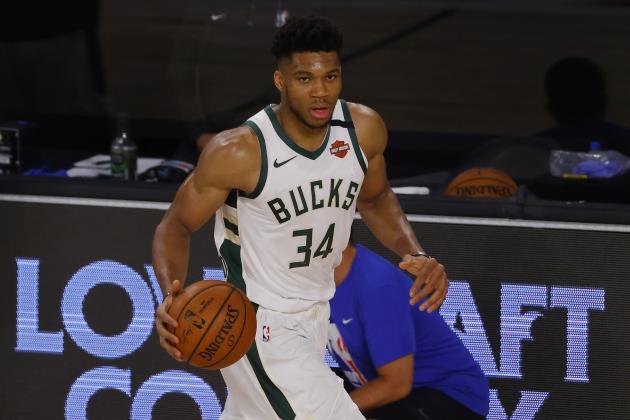 Milwaukee Bucks' Giannis Antetokounmpo (34) moves the ball up court against the Orlando Magic during Game 3 of an NBA basketball first-round playoff series, Saturday, Aug. 22, 2020, in Lake Buena Vista, Fla. (Mike Ehrmann/Pool Photo via AP)