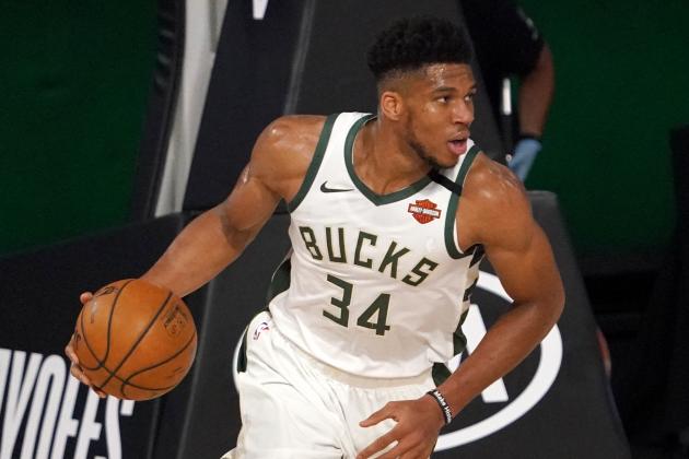 Milwaukee Bucks' Giannis Antetokounmpo (34) handles the ball during the second half of an NBA basketball conference semifinal playoff game against the Miami Heat on Monday, Aug. 31, 2020, in Lake Buena Vista, Fla. (AP Photo/Mark J. Terrill)