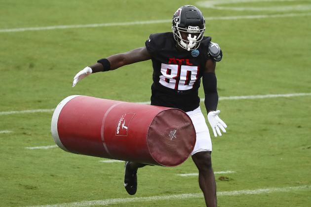Atlanta Falcons wide receiver Laquon Treadwell hits a tackling dummy during an NFL football training camp practice in Flowery Branch, Ga., Monday, Aug. 24, 2020.  (Curtis Compton/Atlanta Journal-Constitution via AP, Pool