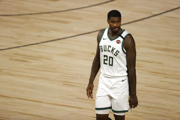 Milwaukee Bucks' Marvin Williams (20) looks on after a fight with Orlando Magic's James Ennis III (11)  during Game 3 of an NBA basketball first-round playoff series, Saturday, Aug. 22, 2020, in Lake Buena Vista, Fla. (Mike Ehrmann/Pool Photo via AP)