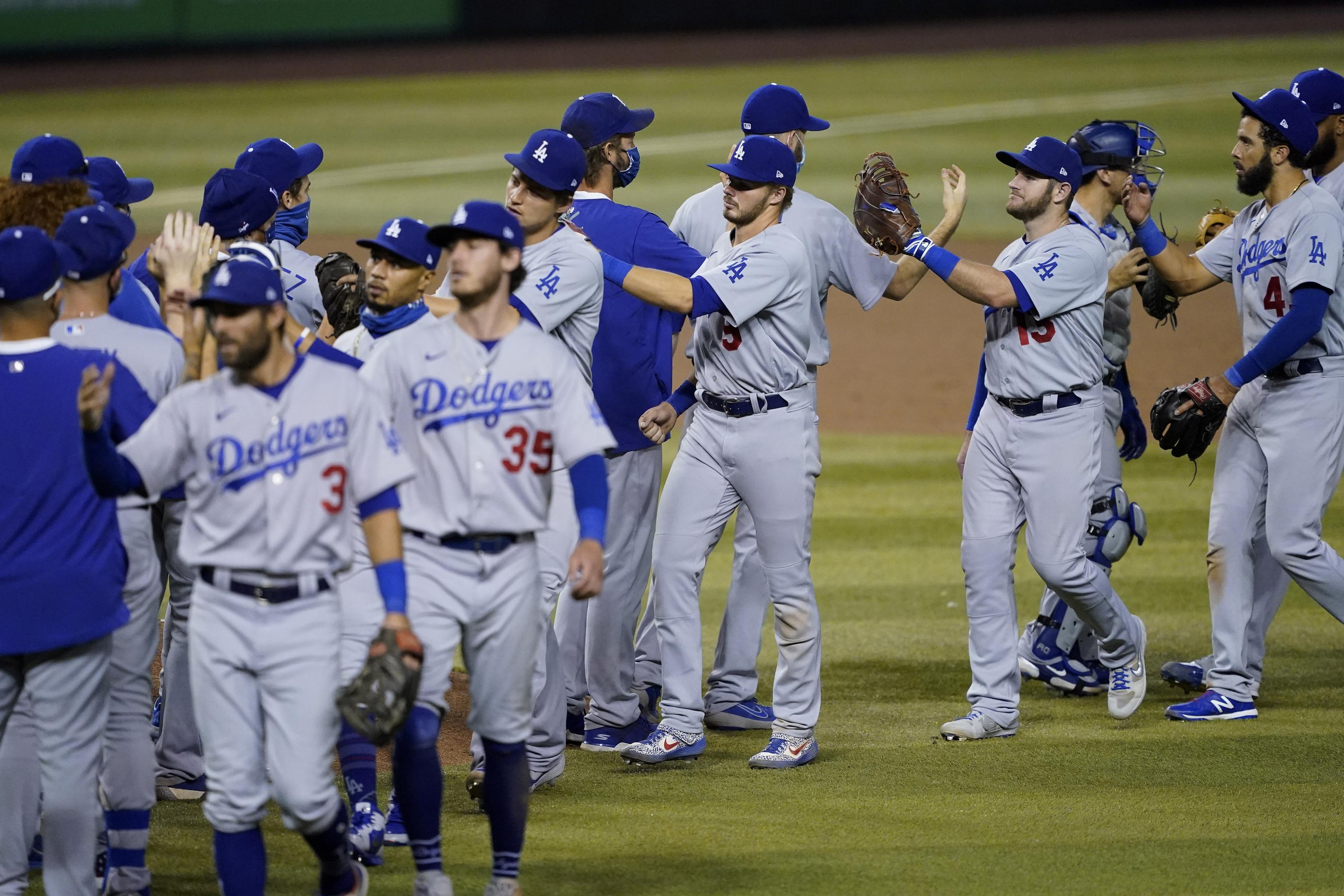 Dodgers 1st team to clinch a playoff spot, rout Padres 11-2
