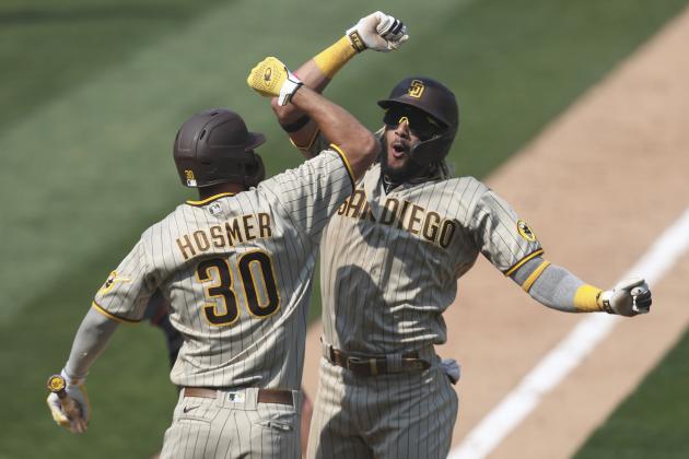 San Diego Padres' Fernando Tatis Jr celebrates after hitting a solo home run against the Oakland Athletics with teammate Eric Hosmer during the seventh inning of a baseball game in Oakland, Calif., Sunday, Sept. 6, 2020. (AP Photo/Jed Jacobsohn)