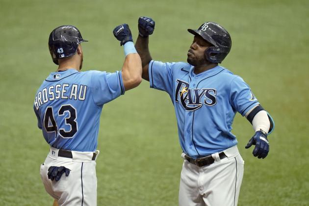 Tampa Bay Rays' Randy Arozarena celebrates his solo home run off Miami Marlins pitcher Trevor Rogers with Michael Brosseau (43) during the first inning of a baseball game Sunday, Sept. 6, 2020, in St. Petersburg, Fla. (AP Photo/Chris O'Meara)