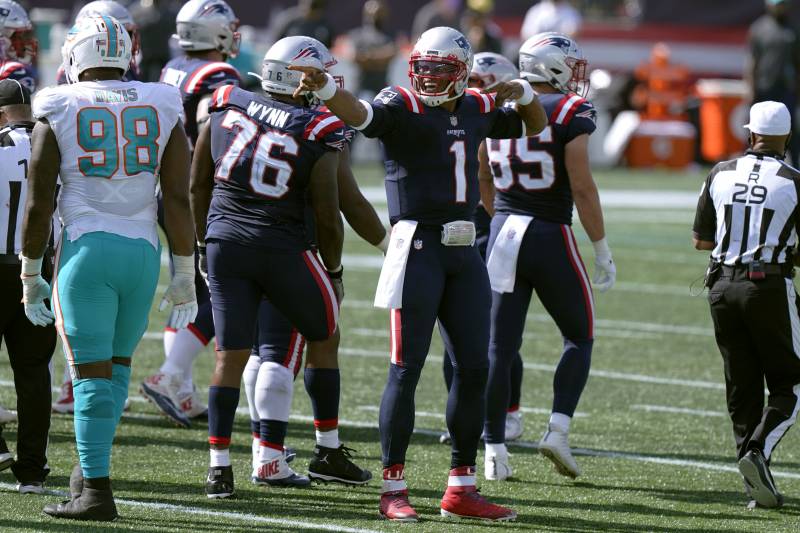 New England Patriots quarterback Cam Newton signals a first down in the second half of an NFL football game against the Miami Dolphins, Sunday, Sept. 13, 2020, in Foxborough, Mass. (AP Photo/Steven Senne)