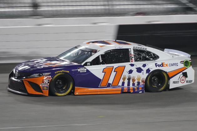 Denny Hamlin (11) drives into Turn 1 during a NASCAR Cup Series auto race Saturday, Sept. 12, 2020, in Richmond, Va. Hamlin who won Stage 1 was called for speeding in the pits and was penalized. (AP Photo/Steve Helber)