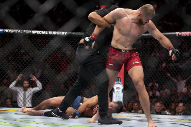 Jan Blachowicz, right, reacts after knocking out Luke Rockhold during the second round of their light heavyweight mixed martial arts bout at UFC 239, Saturday, July 6, 2019, in Las Vegas. (AP Photo/Eric Jamison)