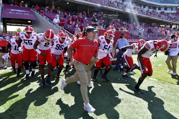 Georgia coach Kirby Smart leads the team onto the field before an NCAA college football game against Arkansas in Fayetteville, Ark., Saturday, Sept. 26, 2020. (AP Photo/Michael Woods)