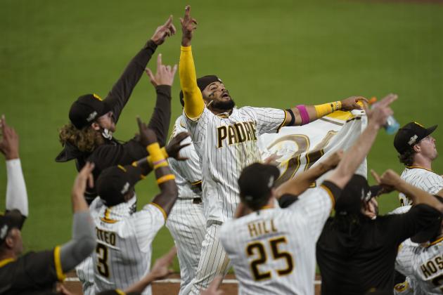 San Diego Padres shortstop Fernando Tatis Jr., center, celebrates with teammates after the Padres defeated the St. Louis Cardinals in Game 3 of a National League wild-card baseball series Friday, Oct. 2, 2020, in San Diego. The Padres won the series 2-1 and advance to the division series. (AP Photo/Gregory Bull)