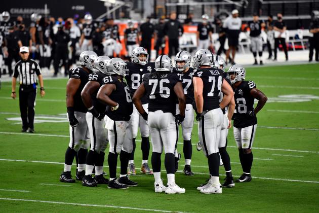 The Las Vegas Raiders huddle between plays against the New Orleans Saints during an NFL football game, Monday, Sept. 21, 2020, in Las Vegas. (AP Photo/Jeff Bottari)