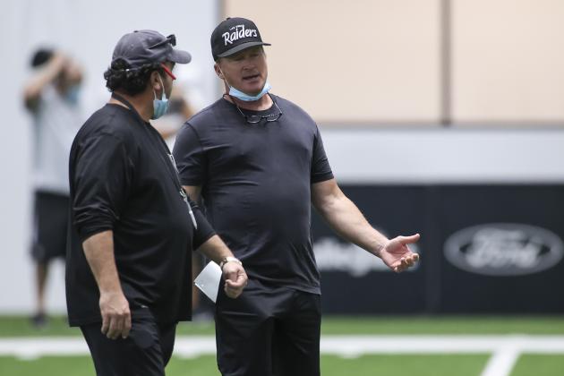 Las Vegas Raiders head coach Jon Gruden, right, talks with defensive coordinator Paul Guenther during an NFL football training camp practice Tuesday, Aug. 25, 2020, in Henderson, Nev. (Chase Stevens/Las Vegas Review-Journal via AP, Pool)