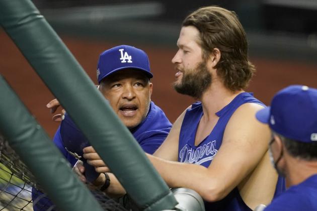 Los Angeles Dodgers manager Dave Roberts talks with starting pitcher Clayton Kershaw before Game 3 of a baseball National League Championship Series against the Atlanta Braves Wednesday, Oct. 14, 2020, in Arlington, Texas. (AP Photo/Tony Gutierrez)