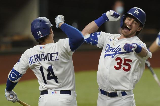 Los Angeles Dodgers' Cody Bellinger, right, celebrates his home run with Enrique Hernandez against the Atlanta Braves during the seventh inning in Game 7 of a baseball National League Championship Series Sunday, Oct. 18, 2020, in Arlington, Texas.(AP Photo/Eric Gay)