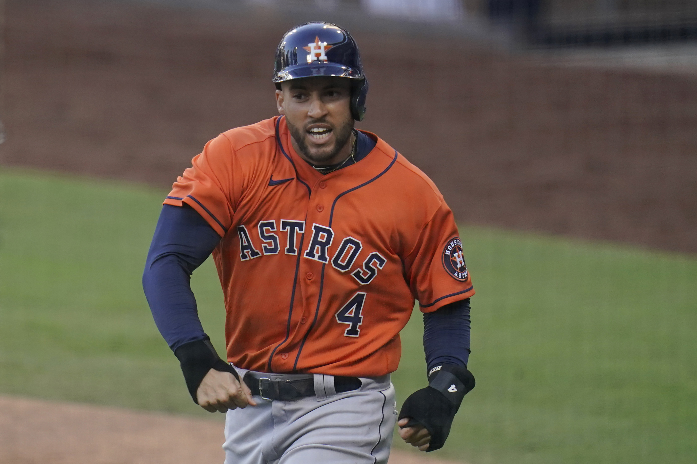 George Springer of the Houston Astros looks on from the top step