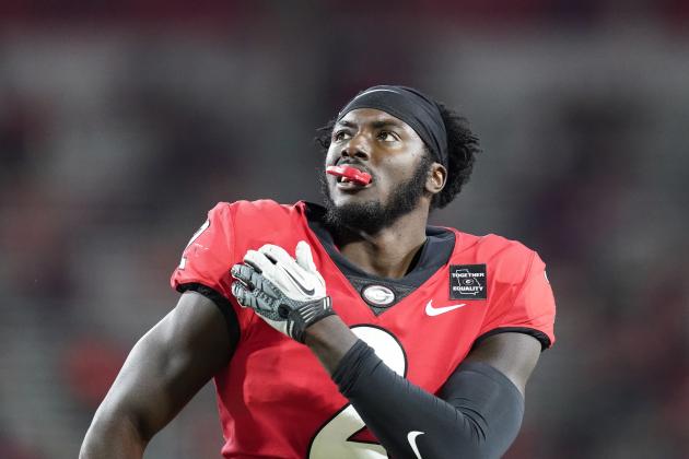 Georgia defensive back Richard LeCounte holds his shoulder during the first half of the team's NCAA college football game against Auburn, Saturday, Oct. 3, 2020, in Athens, Ga. (AP Photo/Brynn Anderson)