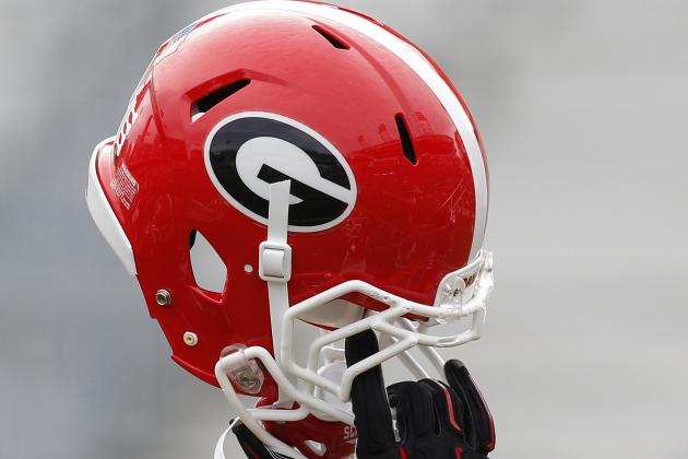 Georgia helmet in the air before a game against Georgia Tech of an NCAA college football game Saturday, Nov. 28, 2015, in Atlanta. (AP Photo/Brett Davis)