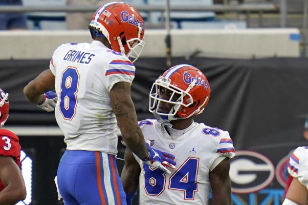 Florida wide receiver Trevon Grimes (8) celebrates his 14-yard touchdown against Georgia with tight end Kyle Pitts (84) during the first half of an NCAA college football game, Saturday, Nov. 7, 2020, in Jacksonville, Fla. (AP Photo/John Raoux)