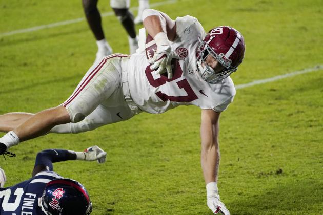 Alabama tight end Miller Forristall (87) is upended as he scores a touchdown against Mississippi during the second half of an NCAA college football game in Oxford, Miss., Saturday, Oct. 10, 2020. Alabama won 63-48. (AP Photo/Rogelio V. Solis)