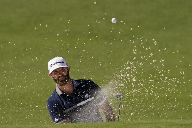 Dustin Johnson watches his bunker shot on the second hole during the second round of the Masters golf tournament Friday, Nov. 13, 2020, in Augusta, Ga. (AP Photo/Charlie Riedel)