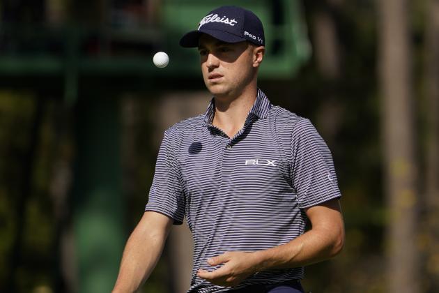 Justin Thomas flips his ball in the air after a birdie on the 15th hole during the second round of the Masters golf tournament Friday, Nov. 13, 2020, in Augusta, Ga. (AP Photo/David J. Phillip)