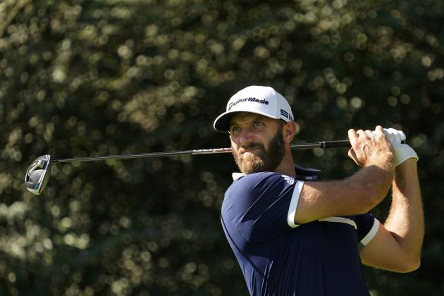 Dustin Johnson watches his tee shot on the 14th hole during the second round of the Masters golf tournament Friday, Nov. 13, 2020, in Augusta, Ga. (AP Photo/David J. Phillip)
