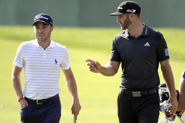 Dustin Johnson, right, talks with Justin Thomas as they approach the 13th green during the first round of the Northern Trust golf tournament, Thursday, Aug. 23, 2018, in Paramus, N.J. (AP Photo/Julio Cortez)