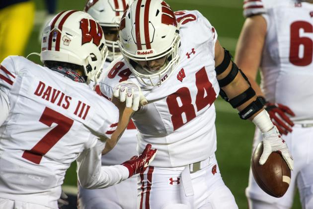 Wisconsin tight end Jake Ferguson (84) celebrates his touchdown with wide receiver Danny Davis III (7) in the third quarter of the team's NCAA college football game against Michigan in Ann Arbor, Mich., Saturday, Nov. 14, 2020. Wisconsin won 49-11. (AP Photo/Tony Ding)