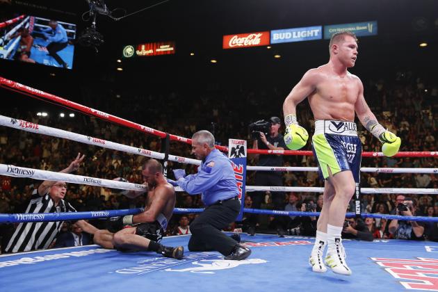 Canelo Alvarez, right, walks to his corner after knocking down Sergey Kovalev during a light heavyweight WBO title bout, Saturday, Nov. 2, 2019, in Las Vegas (AP Photo/John Locher)