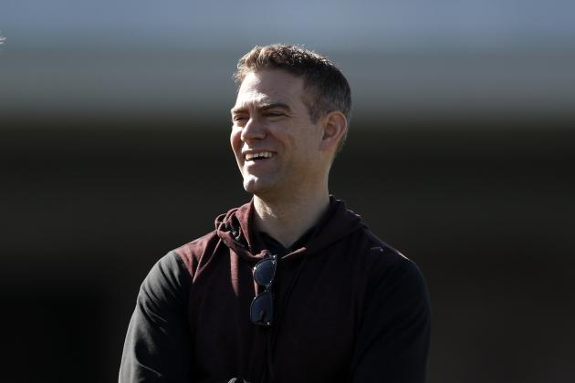 Chicago Cubs president of baseball operations Theo Epstein looks on during a spring training baseball workout Wednesday, Feb. 12, 2020, in Mesa, Ariz. (AP Photo/Gregory Bull)