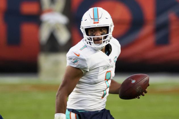 Miami Dolphins quarterback Tua Tagovailoa (1) looks to pass while running with the football against the Denver Broncos during the second half of an an NFL football game, Sunday, Nov.. 22, 2020, in Denver. (AP Photo/Justin Edmonds)