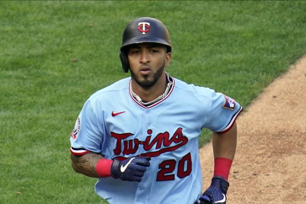 Minnesota Twins' Eddie Rosario (20) scores a run against the Detroit Tigers in a baseball game Sunday, Sept. 6, 2020, in Minneapolis. (AP Photo/Jim Mone)