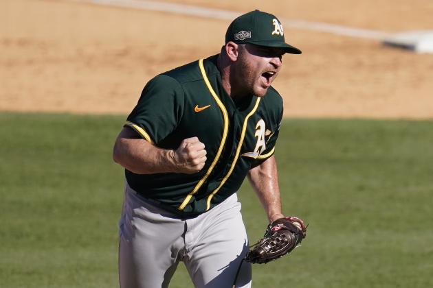 Oakland Athletics pitcher Liam Hendriks reacts after striking out Houston Astros' Josh Reddick during the eighth inning of Game 3 of a baseball American League Division Series in Los Angeles, Wednesday, Oct. 7, 2020. (AP Photo/Marcio Jose Sanchez)