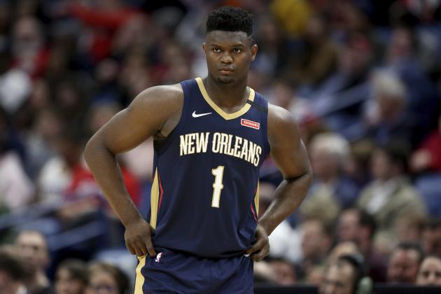 FILE - In this March 6, 2020, file photo, New Orleans Pelicans forward Zion Williamson walks onto the court during the second half of the team's NBA basketball game against the Miami Heat in New Orleans. The rookie sensation’s availability to play remained unclear as the season’s resumption in Lake Buena Vista, Florida, approached. He left the NBA’s so-called “bubble” setup on July 16 to attend to an unspecified family medical matter. A week later, the club had yet to provide an update on his possible return. (AP Photo/Rusty Costanza, File)