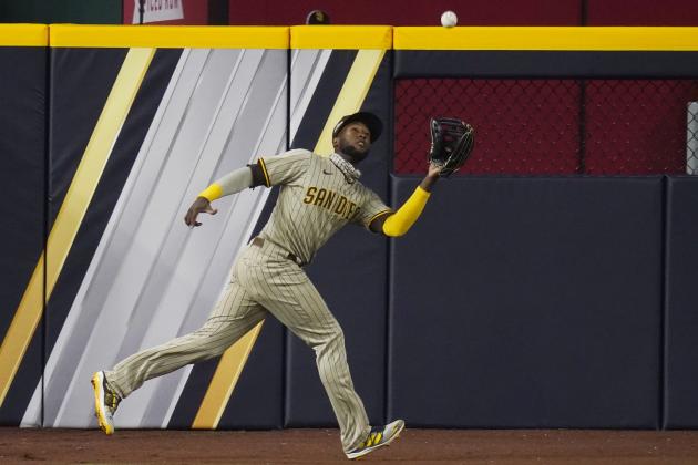 San Diego Padres left fielder Jurickson Profar (10) catches a flyout hit by Los Angeles Dodgers' Enrique Hernandez during the seventh inning in Game 1 of a baseball NL Division Series, Tuesday, Oct. 6, 2020, in Arlington, Texas. (AP Photo/Sue Ogrocki)