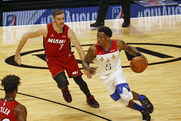 New Orleans Pelicans guard Eric Bledsoe (5) dribbles against Miami Heat guard Goran Dragic (7) during the first half of an NBA basketball game, Friday, Dec. 25, 2020, in Miami. (AP Photo/Joel Auerbach)