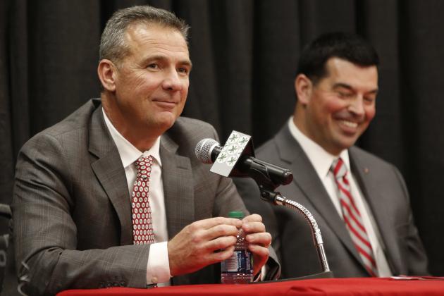 Ohio State NCAA college football head coach Urban Meyer, left, answers questions during a news conference announcing his retirement Tuesday, Dec. 4, 2018, in Columbus, Ohio. At right is assistant coach Ryan Day. (AP Photo/Jay LaPrete)