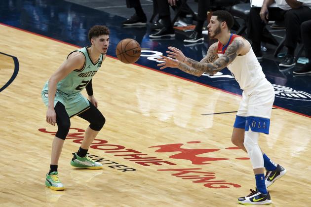 New Orleans Pelicans guard Lonzo Ball (2) passes the ball as Charlotte Hornets guard LaMelo Ball (2) defends during the second quarter of an NBA basketball game in New Orleans, Friday, Jan. 8, 2021. (AP Photo/Derick Hingle)