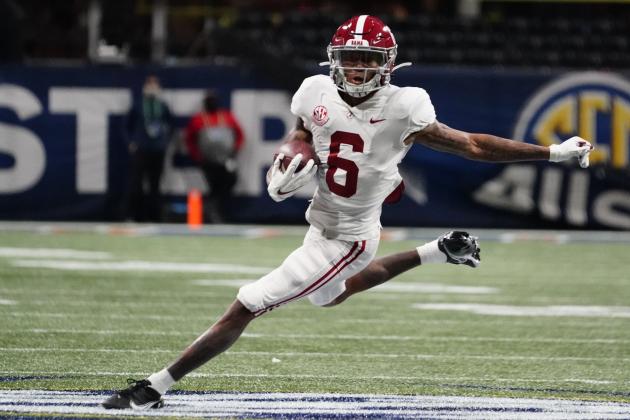FILE - In this Saturday, Dec. 19, 2020, file photo, Alabama wide receiver DeVonta Smith (6) runs against Florida during the first half of the Southeastern Conference championship NCAA college football game in Atlanta. Smith has been named a finalist for the Heisman Trophy. The Heisman will be awarded Jan. 5 during a virtual ceremony as the pandemic forced the cancellation of the usual trip to New York that for the presentation that usually comes with being a finalist.  (AP Photo/Brynn Anderson, File)