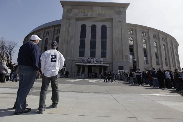 New York Yankee fans Sonny Gutic, left, and Jared Fritch look at the facade outside Gate 4 of the new Yankee Stadium before watching the Yankees work out Thursday, April 2, 2009, at the stadium in New York. (AP Photo/Julie Jacobson)