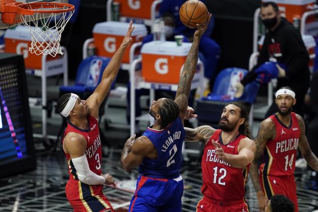 Los Angeles Clippers forward Kawhi Leonard (2) shoots between New Orleans Pelicans guard Josh Hart (3) and center Steven Adams (12) during the second quarter of an NBA basketball game Wednesday, Jan. 13, 2021, in Los Angeles. (AP Photo/Ashley Landis)