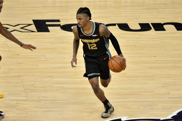 Memphis Grizzlies guard Ja Morant (12) handles the ball in the first half of an NBA basketball game against the Phoenix Suns Monday, Jan. 18, 2021, in Memphis, Tenn. (AP Photo/Brandon Dill)