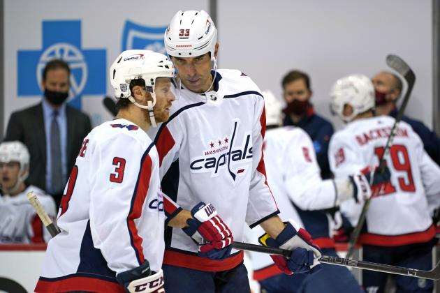 Washington Capitals' Zdeno Chara (33) talks with Nick Jensen during the second period of an NHL hockey game against the Pittsburgh Penguins in Pittsburgh, Sunday, Jan. 17, 2021. (AP Photo/Gene J. Puskar)
