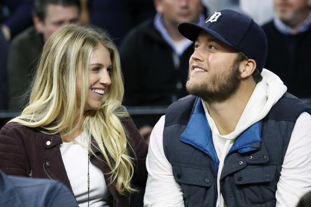 FILE - In this Nov. 17, 2015, file photo, Detroit Lions quarterback Matthew Stafford and his wife Kelly smile while watching the Detroit Pistons play the Cleveland Cavaliers during an NBA basketball game, in Auburn Hills, Mich. Matthew is juggling his job on the field and his role as a husband and father as his wife, Kelly, recovers from surgery to remove a brain tumor. (AP Photo/Duane Burleson, File)