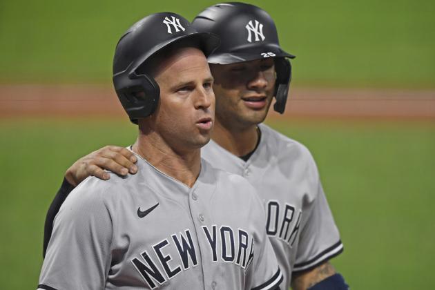 New York Yankees' Brett Gardner (11) walls to the dugout with Gleyber Torres after hitting a two run home run in the seventh inning of Game 1 of an American League wild-card baseball series against the Cleveland Indians, Tuesday, Sept. 29, 2020, in Cleveland. (AP Photo/David Dermer)